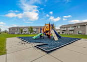Thumbnail 4 of 10 - A playground with a slide and a green slide cover.