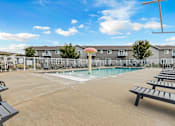 Thumbnail 2 of 10 - A sunny day at the pool of a residential complex.