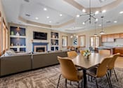 Thumbnail 2 of 9 - A modern dining room with a large table and chairs.