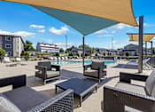 Thumbnail 3 of 8 - A sunny day at the poolside with lounge chairs and umbrellas.