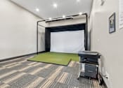 Thumbnail 2 of 10 - A room with a green mattress and a black table.