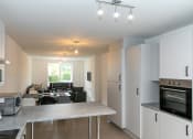 Thumbnail 6 of 8 - a kitchen and living room in a house
