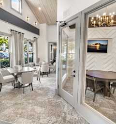 A dining room with a table and chairs is shown.