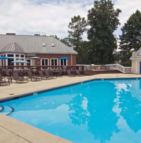 the swimming pool at our hotel with chairs around it