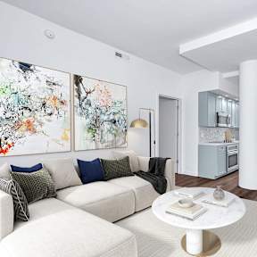 Living room with White Couch at The Glover House Apartments, Washington, DC, 20007