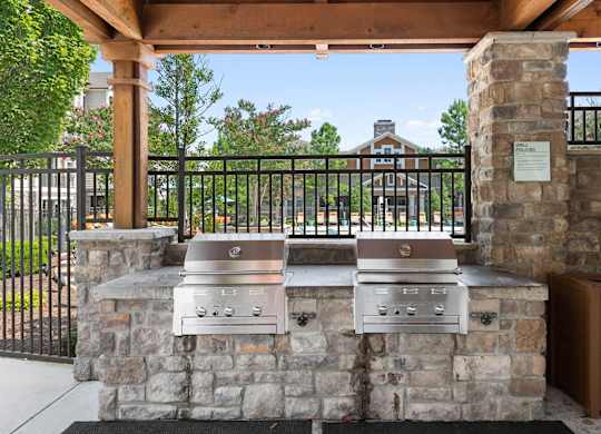 Outdoor barbecue grills at Atley on the Greenway Apartments in Ashburn VA