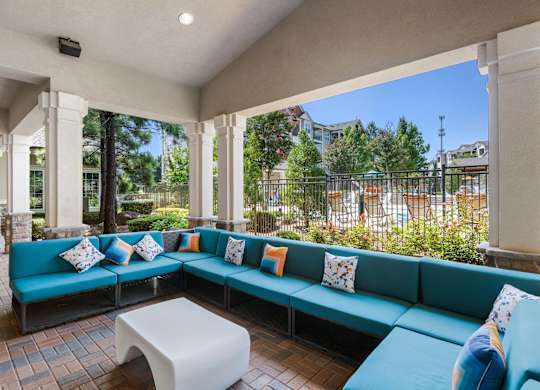 Outdoor fireside lounge seating at Atley on the Greenway Apartments in Ashburn VA