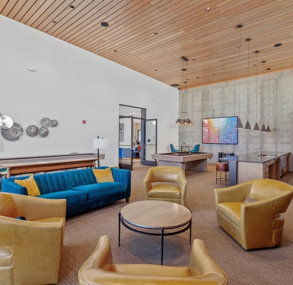 A living room filled with furniture and a pool table