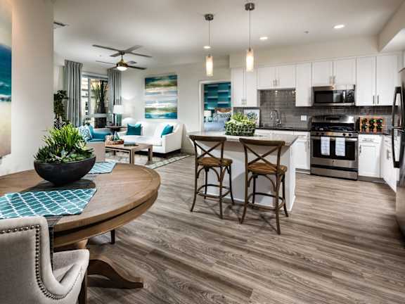 One11 Apartments in Corona, California Model Kitchen with Island and Living Room