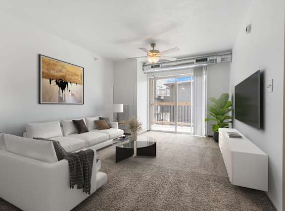 A living room with a white couch and a painting on the wall.
