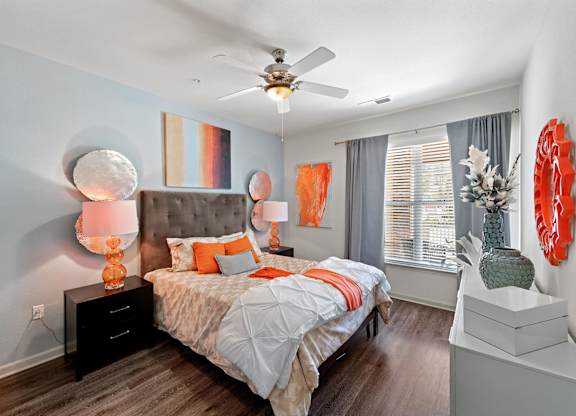Bedroom with ceiling fan and window at Atley on the Greenway Apartments in Ashburn VA