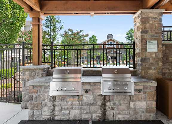 Outdoor barbecue grills at Atley on the Greenway Apartments in Ashburn VA