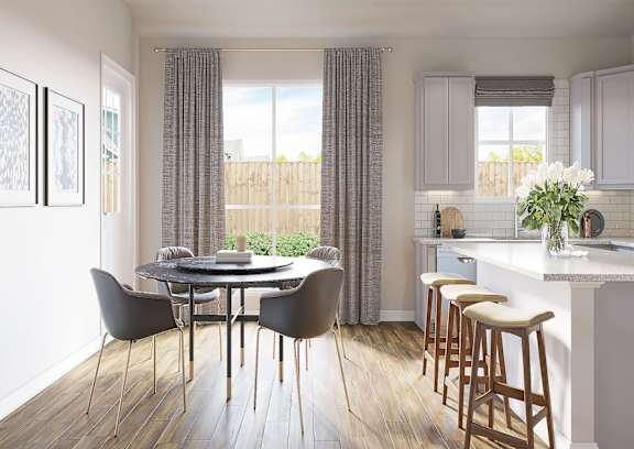 A modern kitchen with a dining table and chairs at Walker Place Apartments, Texas, 76643