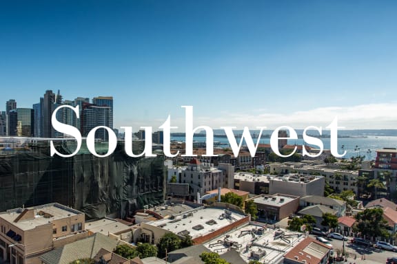 the word southwest over a picture of the city