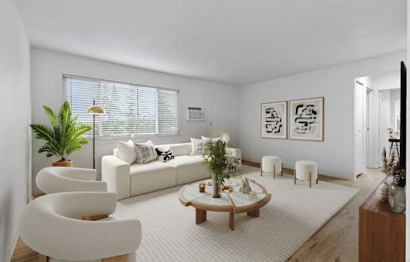 A living room with a white couch, a white chair, a white rug, and a white floor.