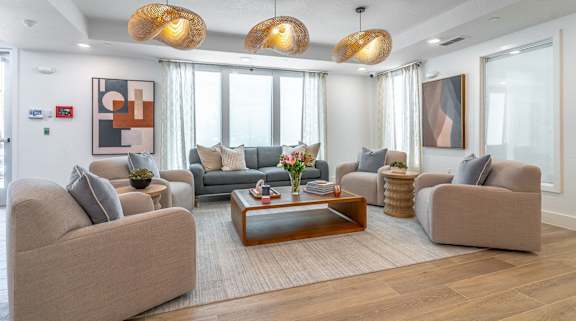 A living room with a coffee table and couches.
