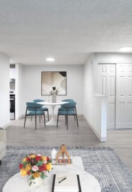 a living room with white walls and a yellow chair at Veri at Timberhill, Corvallis, OR,