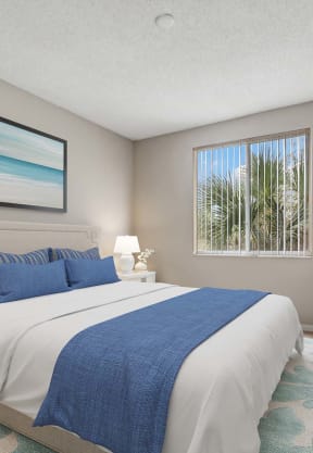 a bedroom with a bed and a window at Cypress Shores, Coconut Creek