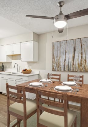 a kitchen and dining area in a 555 waverly unit at Acacia Gardens, New Mexico, 87111