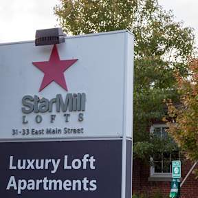 Property entrance sign with landscaping at Star Mill Lofts Apartments, Middleboro, MA