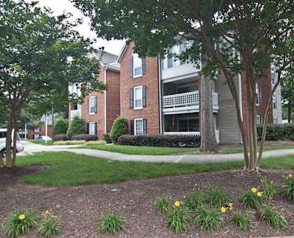 our apartments are located in a quiet neighborhood with trees and grass