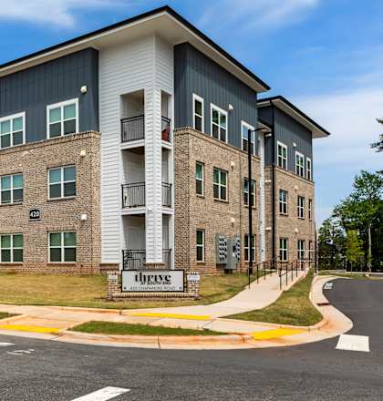 A large apartment complex with the name "Crestmoor" on the front.