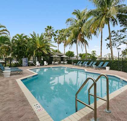 Outdoor Swimming pool at Brenton at Abbey Park Apartments in West Palm Beach FL