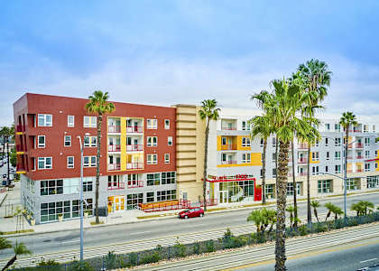 a row of colorful apartment buildings on the side of a street