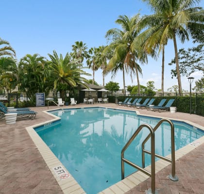 Outdoor Swimming pool at Brenton at Abbey Park Apartments in West Palm Beach FL