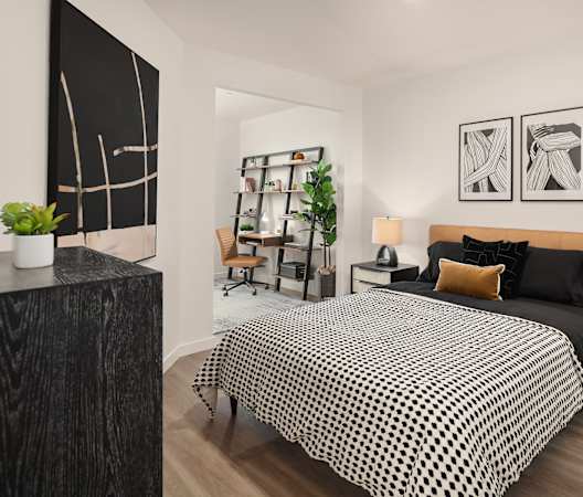 a bedroom with a large bed in a 555 waverly unit at The Hemlock, Seattle, WA