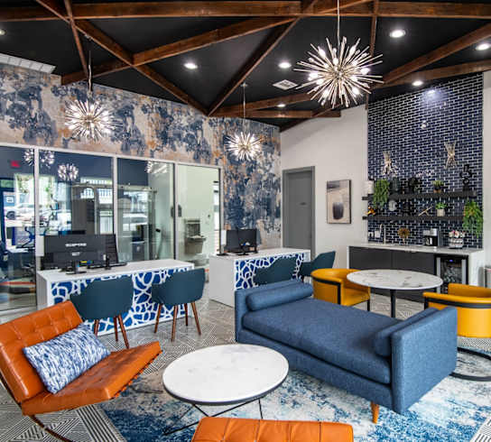 Stadium 700 leasing center with blue couches and chairs and tables