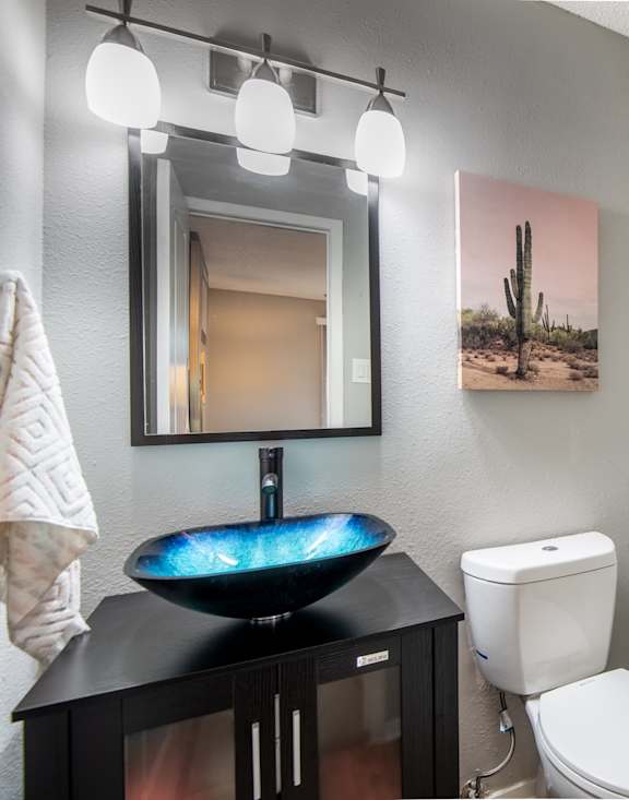 Stadium 700 bathroom with a sink and a toilet and a shower
