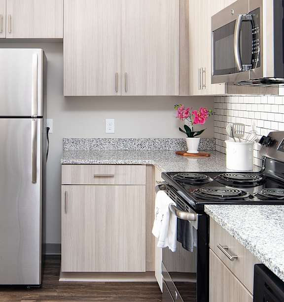 Kitchen with Cabinetry at One White Oak Apartments, Cumming, 30041