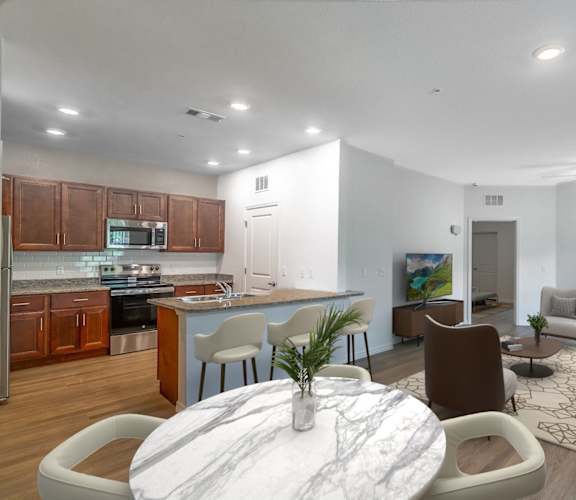 A modern living room with a white marble coffee table and brown chairs.