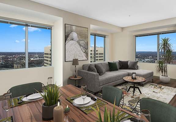 a living room with a couch and a table with chairs