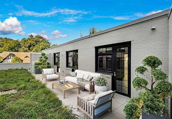A modern house with a patio and outdoor furniture at Seminary Towers, Alexandria