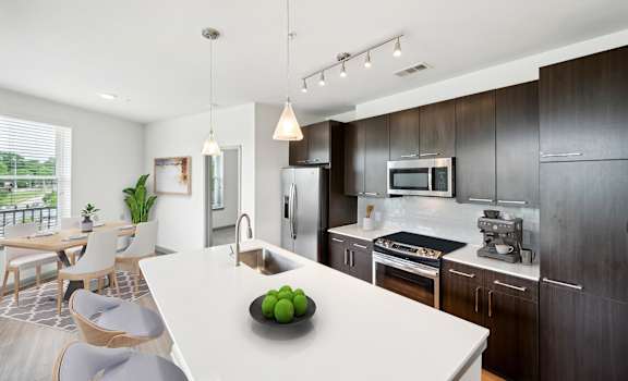 a kitchen with a white counter top at Glenwood at Grant Park, Georgia, 30316