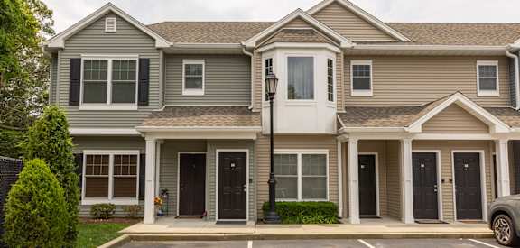 a house with a parking lot in front of it
