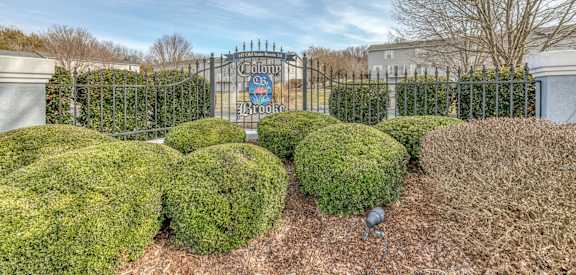 A gated entrance with a sign that reads "Chateau".