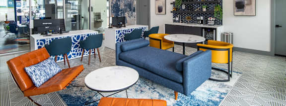 Stadium 700 leasing center with blue couches and chairs and tables