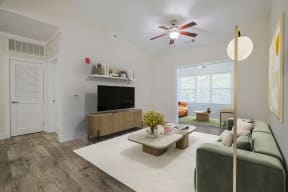 a living room with a couch and a tv