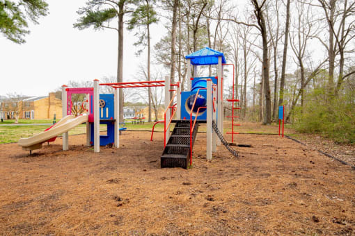 a playground with a slide and climbing equipment