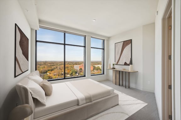 the master bedroom has a view of the city