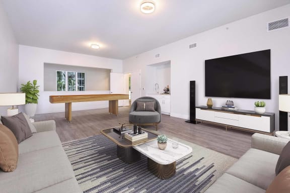 a living room with a couch and a television at Paramount on Lake Eola Apartments, Orlando, Florida