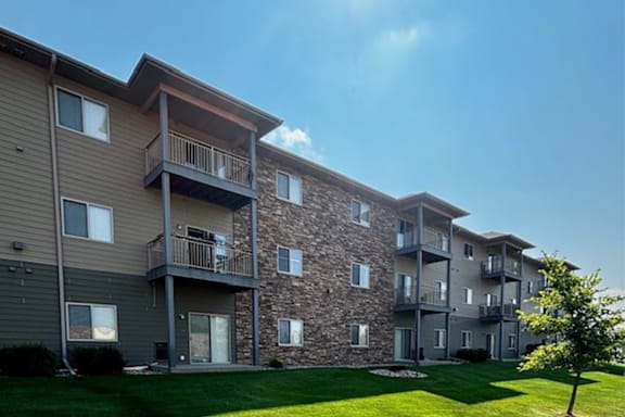 A large apartment complex with a central courtyard and multiple balconies.