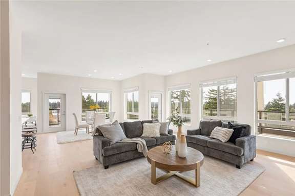 A living room with grey couches and a coffee table.
