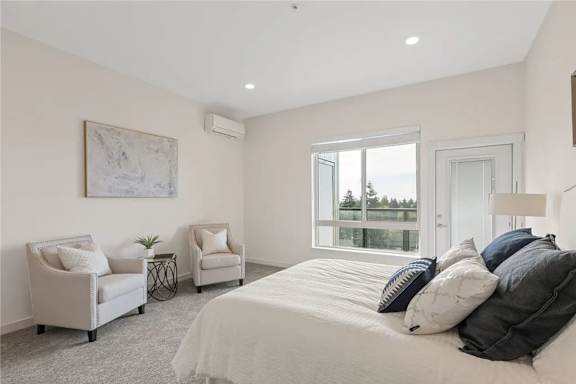 A bedroom with a large bed, two chairs, and a painting on the wall.