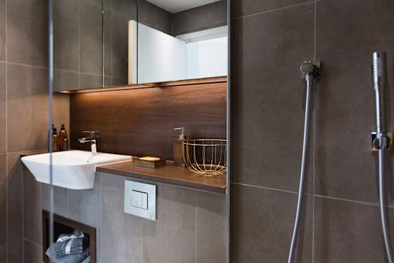 a small bathroom with a shower and a sink