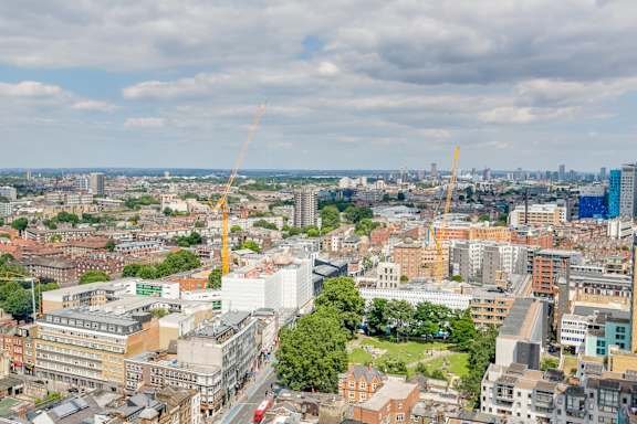 a view of the city from the top of a skyscraper