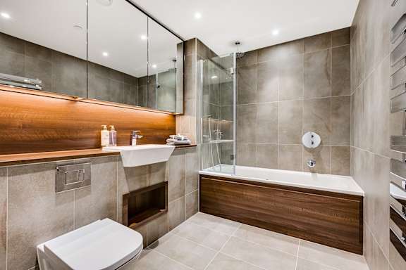 a bathroom with a sink toilet and a shower
